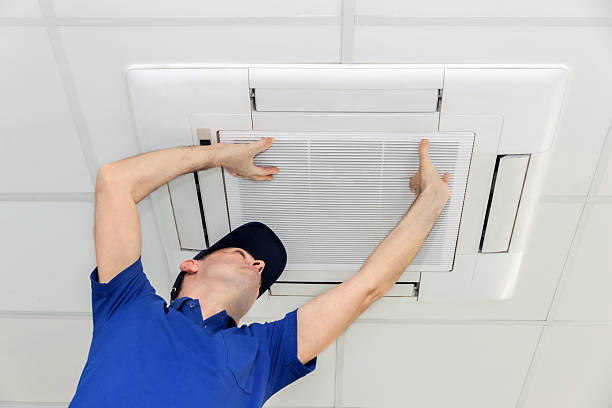 AC technician servicing unit